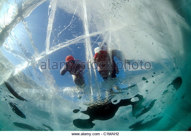 the-girl-looks-through-ice-lake-baikal-siberia-russia-island-olkhon-c1mah2.jpg.155f0311f5c5c6b041e8024ca38cc4a9.jpg